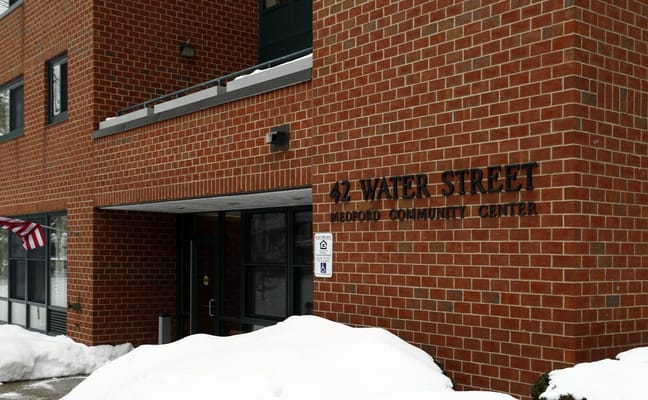 Entrance of Water Street Apartments with signage visible