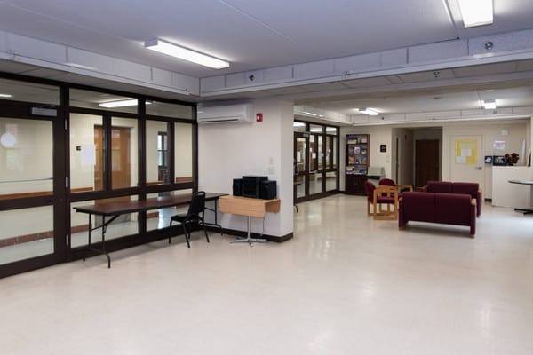 Interior view of the lobby at Tempone Apartments showing seating and amenities.