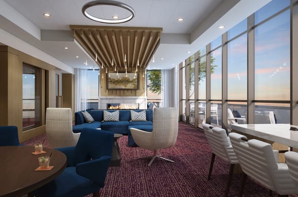 Spacious common area with modern furniture and large windows