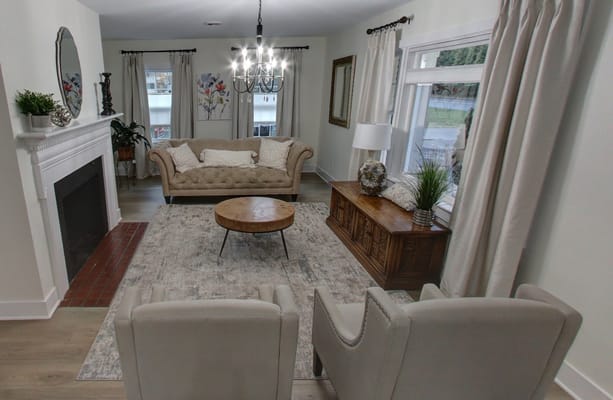 Cozy living room with a sofa, chairs, and a coffee table