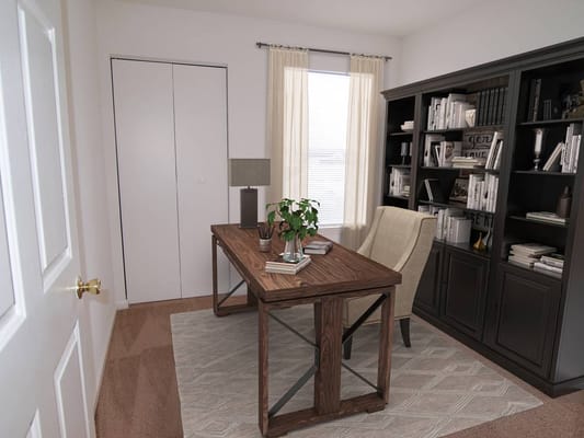 Bright office space with a wooden desk and bookshelves
