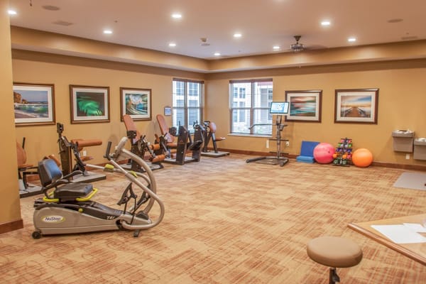 Inner fitness area with exercise equipment and vibrant decor