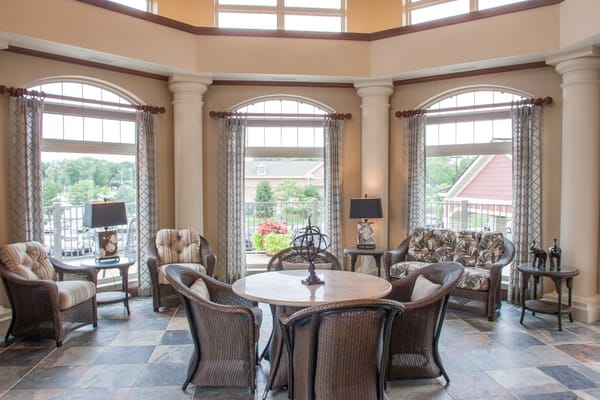 Bright common area with comfortable seating and windows