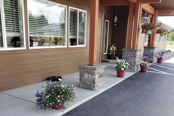 Colorful flower pots at the entrance of Harmony House Assisted Living
