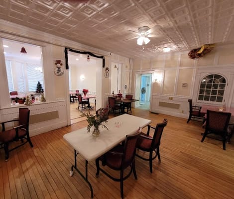 Dining area with tables and chairs ready for residents