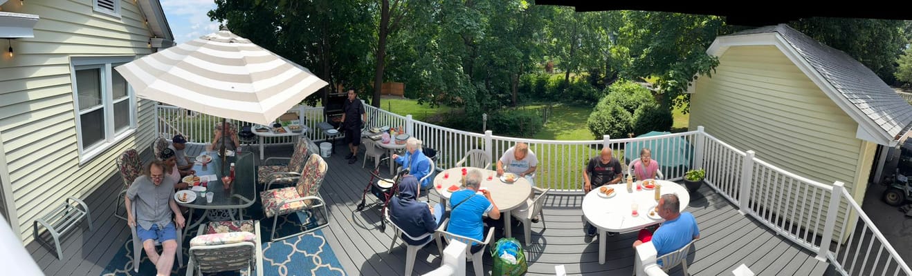 Residents enjoying lunch on a patio