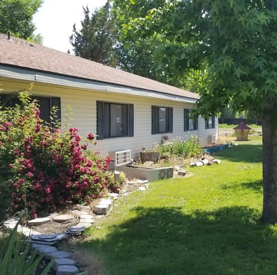 Side view of a residential building with gardens