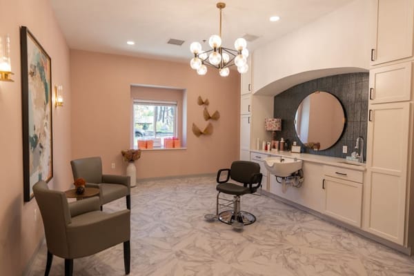 Hair salon area inside the facility with chairs and decor