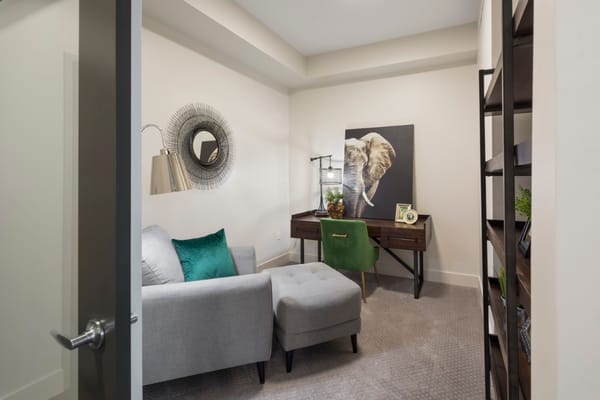 A cozy interior room with a desk and chair