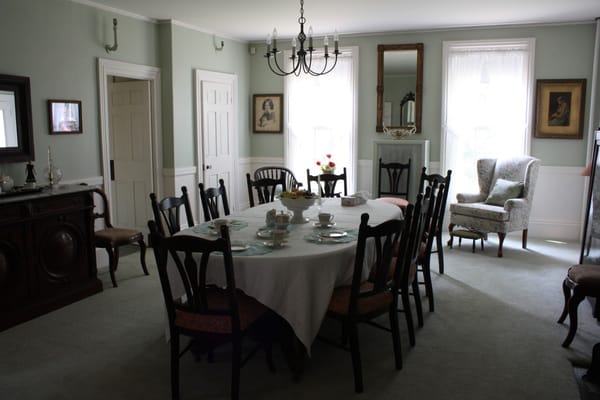 Dining room set with a large table and chairs
