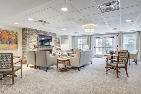 Cozy lounge area with comfortable seating and a TV.