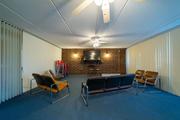 Common area with seating and TV