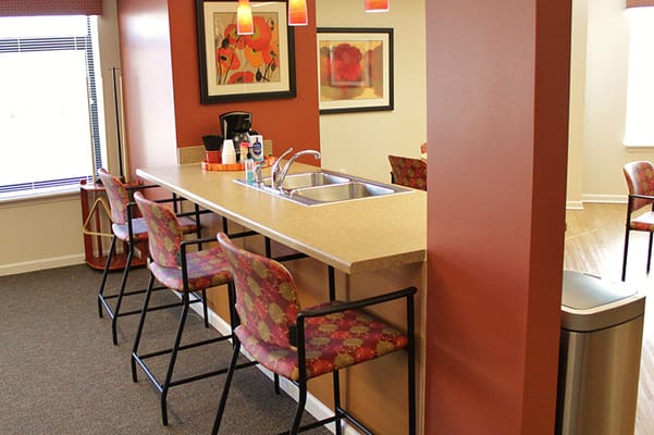 Kitchen bar area with seating and decorative wall art