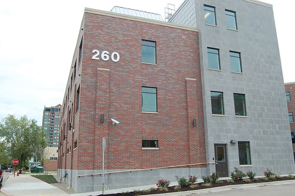 The exterior of The Thome Rivertown Neighborhood with address number 260 visible.