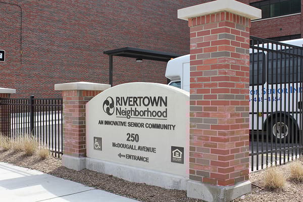 Entrance sign of The Thome Rivertown Neighborhood senior community