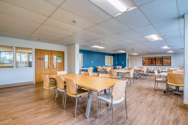 Bright interior of a dining area with tables and chairs