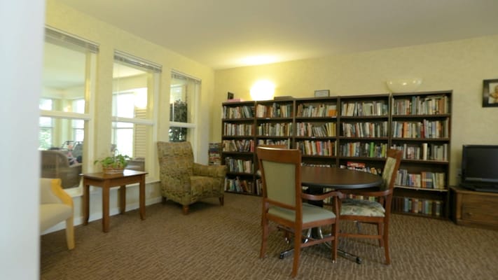 Interior view of a cozy library area with bookshelves