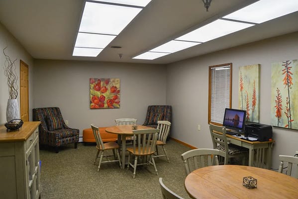 Bright common area with tables and chairs
