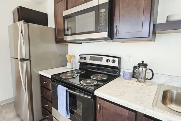 Modern kitchen area with appliances and counter space
