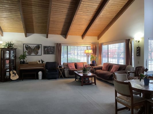 Bright common area with seating and natural light