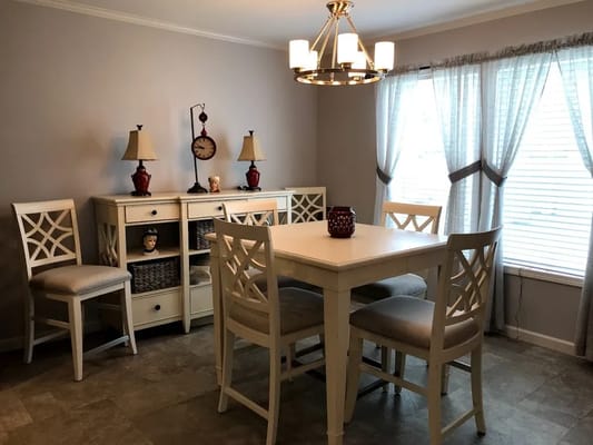 Bright dining area with chairs and a table