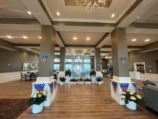 Lobby of Hampton Manor of Winchester featuring decorative banners and plants.
