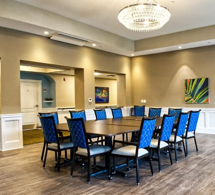 Interior common area with a large table and chairs