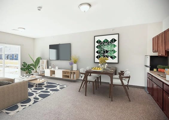 A bright living and dining area featuring a sofa, dining table, and TV.