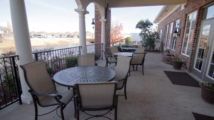Outdoor seating area with tables and chairs