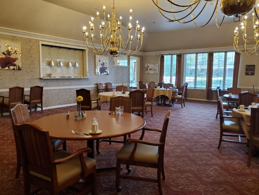 Spacious dining room with tables and chairs at Radiance Senior Living.