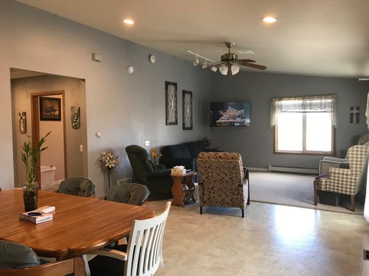 A spacious living room with comfortable seating and a dining area
