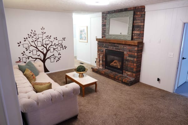Cozy lounge area with a comfortable sofa and wall decor