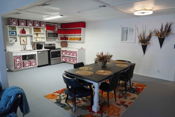 Modern dining area with kitchen in a senior living facility