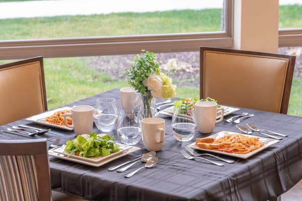 Dining table set with food and drinks in a dining area
