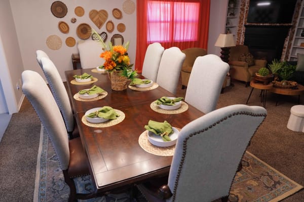 Warmly decorated dining room with a large table