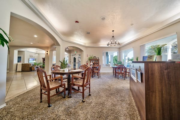 Interior view of a common area with tables and chairs