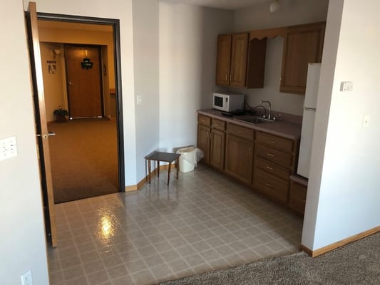 Interior view of a kitchenette area in a resident unit