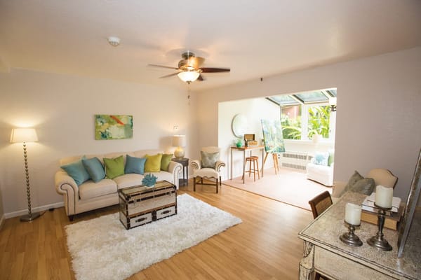 Bright common area with cozy seating and decor