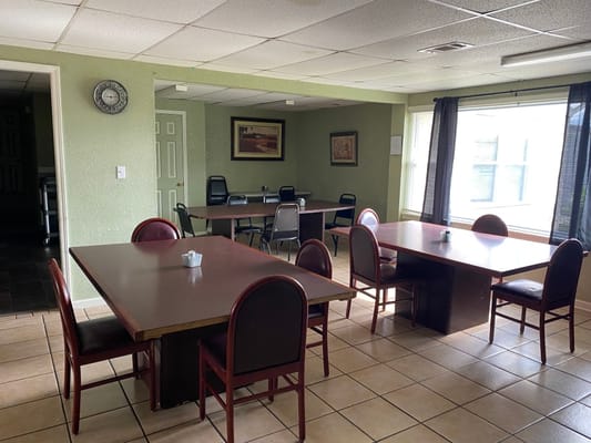 Dining area with tables and chairs in an interior setting