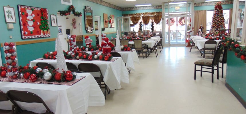 Dining area decorated for the holidays with festive centerpieces.