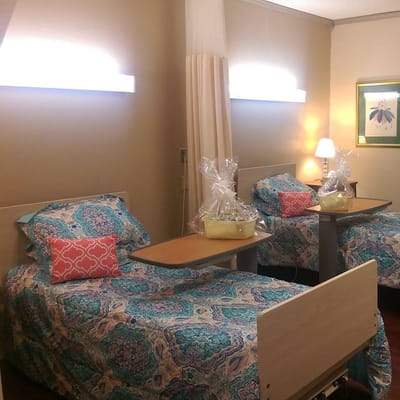 Two inviting beds with colorful bedding in a shared room