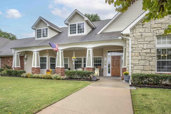 Exterior view of the assisted living facility with a porch