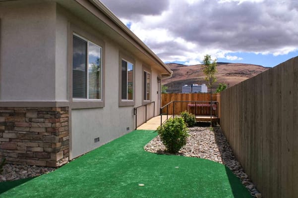 A pathway leading to an outdoor seating area