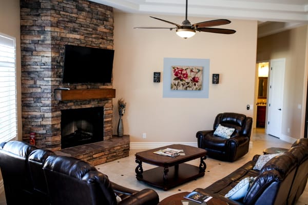 Cozy common area with seating and a fireplace