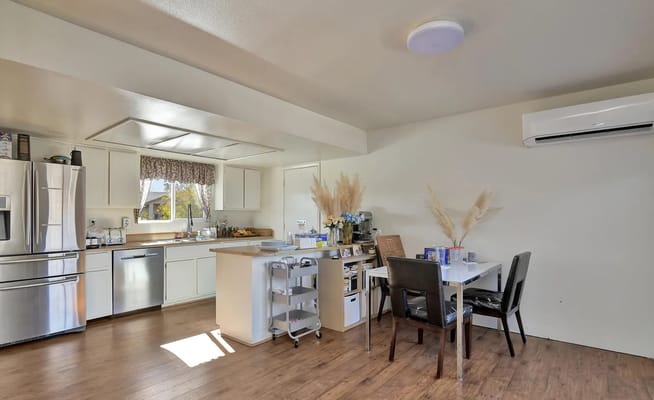 Bright kitchen with modern appliances and a dining area