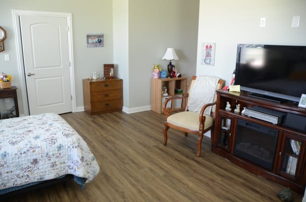 Cozy resident room with a bed and seating area