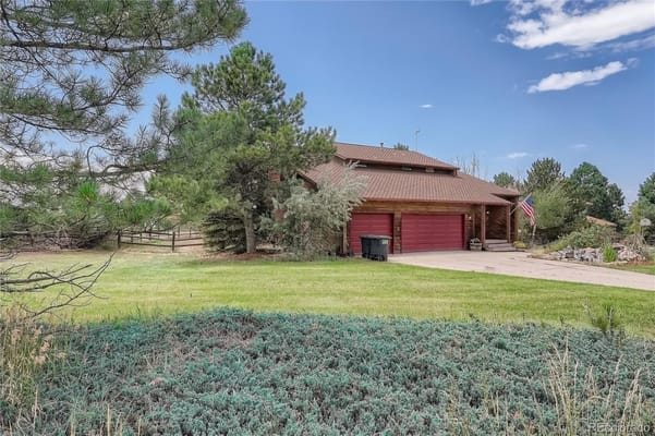 Exterior view of a facility building with landscaping
