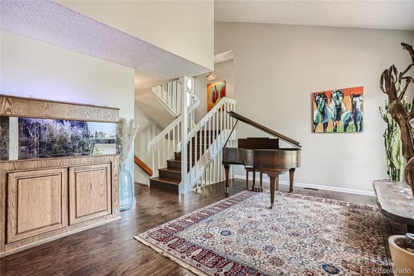 Interior common area with piano and seating
