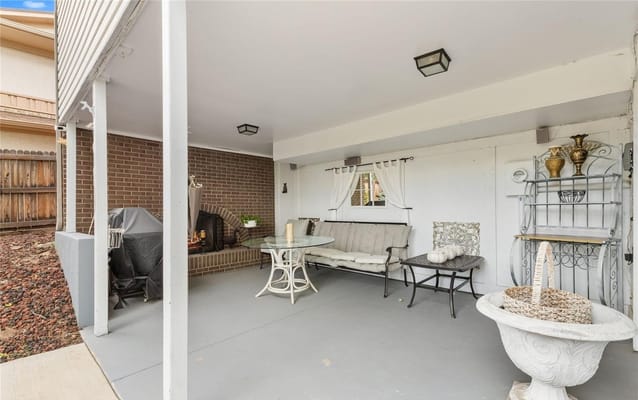 Covered outdoor seating area with furniture and decor