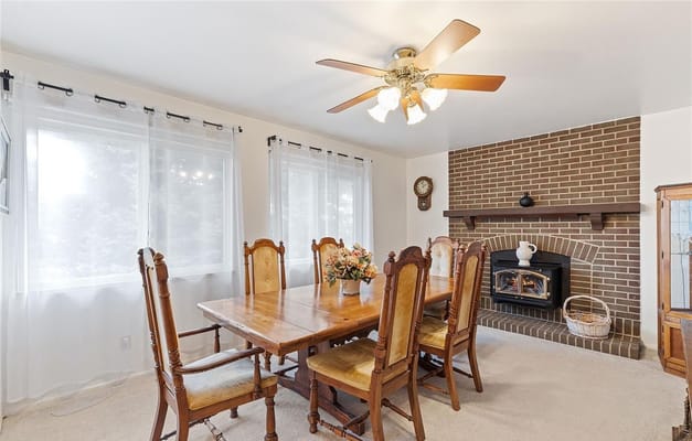 Bright interior dining area with wooden table and chairs